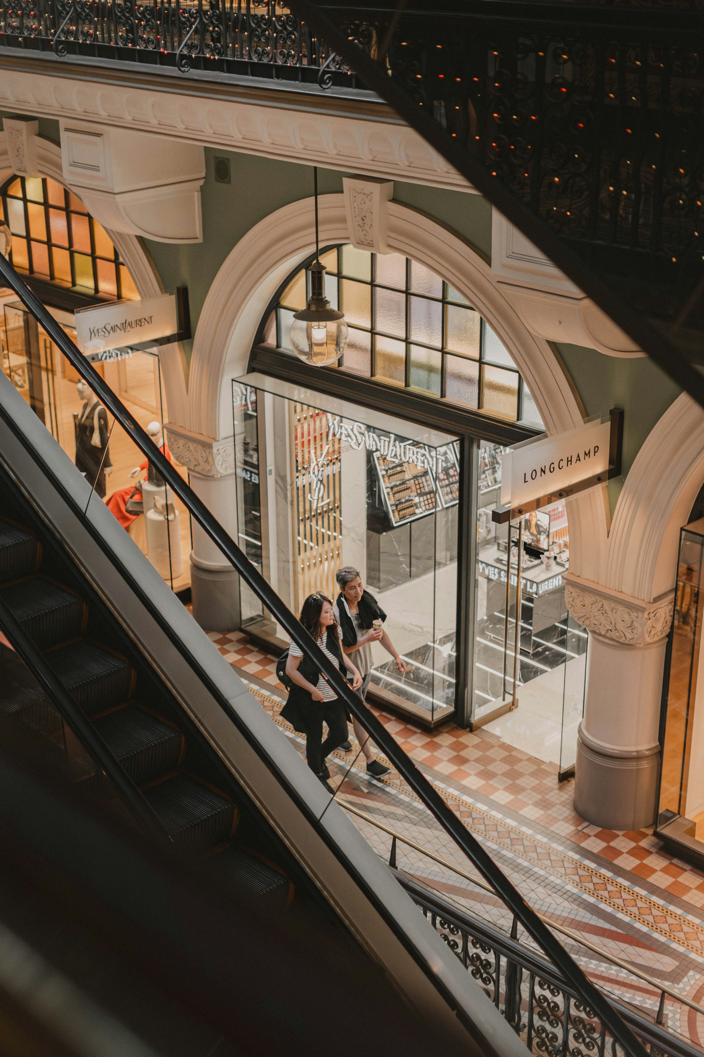 Luxury shopping arcade with premium retail brands.